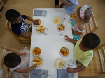 kids having breakfast in our montessori school