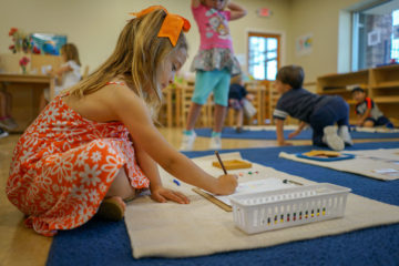 girl kid solving math puzzle at montessori school cypress